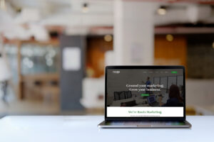 laptop with Roots Marketing website